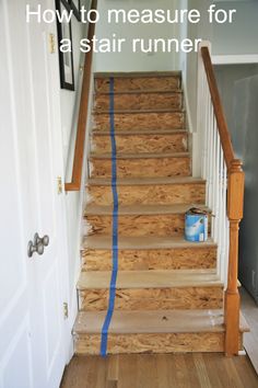 the stairs are being painted with blue tape