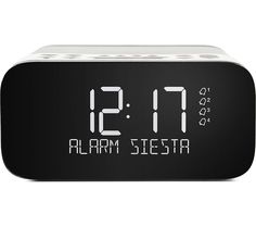 the alarm clock is black and white with numbers displayed on it's front side