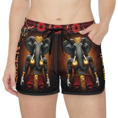 an elephant is standing in front of a woman's shorts