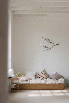 a living room with white walls and furniture