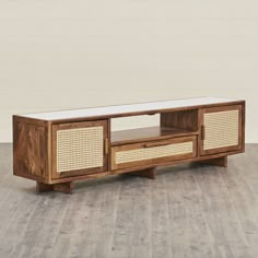 the sideboard is made out of wood and has wicker panels on it's sides