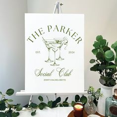 there is a sign that says the parker social club next to a potted plant