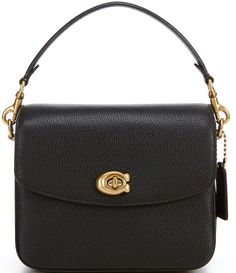 From COACH&#x2C; the Cassie Pebble Leather Crossbody Bag features:Polished pebble leatherTurn-lock closureFabric liningInterior: Zip and multifunction pocketsExterior: Slip pocketDetachable short strapDetachable chain strapDetachable strap for shoulder or crossbody wearApprox. 7.75" L x 6.5" H x 3.25" W bag; 4" short strap drop; 9" chain strap drop; 21.25" detachable strap dropImported. Coach Cassie, Designer Handbags Louis Vuitton, Coach Handbags Outlet, Chloe Handbags, Polished Pebble, Gucci Models, Black Leather Crossbody Bag, Handbag Outlet, Canvas Handbags