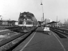 an old photo of a train pulling into the station