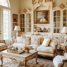 a living room filled with lots of furniture next to a window covered in pictures and paintings