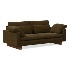 a brown couch sitting on top of a white floor