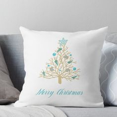 a merry christmas tree with blue and gold ornaments on it's back throw pillow