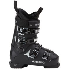 a pair of black ski boots with white and silver accents on the bottom, side view