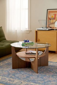 a living room with a couch, coffee table and rug