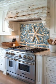 a stove top oven sitting inside of a kitchen next to a wall covered in seashells