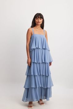 Tiered Chiffon Maxi Dress Blue | NA-KD Bridesmaid Maxi Dress With Ruffled Straps, Tiered Maxi Dress With Layered Hem For Party, Flowy Maxi Dress With Ruffled Straps For Bridesmaids, Layered Tiered Evening Maxi Dress, Tiered Ruffle Maxi Dress For Bridesmaids, Tiered Ruffle Bridesmaid Maxi Dress, Blue Chiffon Dress With Ruffled Straps, Layered Chic Maxi Dress, Summer Party Maxi Dress With Layered Hem