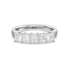 a white gold ring with five princess cut diamonds