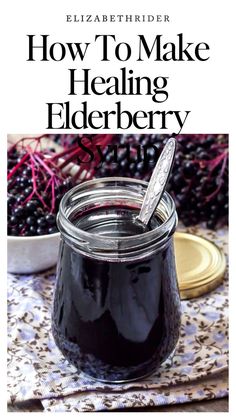 a jar filled with elderberry jam sitting on top of a table