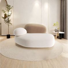 a modern living room with white furniture and wood flooring on the walls, along with a round rug