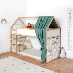 a child's bedroom with a bunk bed and stuffed animals on the rugs