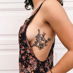 the back of a woman's breast with flowers on it and an instagram