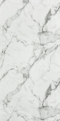 a white marble textured surface with grey veiners