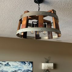 a wooden chandelier hanging from the ceiling