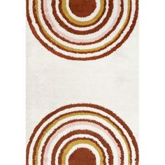 two rugs with circles on them in brown and white