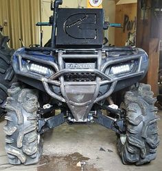 the front end of an atv in a garage