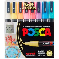 a box of assorted markers and pens with the words posca written on them