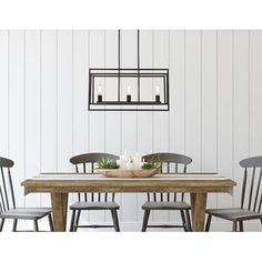 a dining room table with chairs and a chandelier