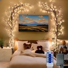 a bedroom decorated with christmas lights and teddy bears on the bed in front of a painting