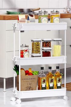 a white shelf filled with lots of food and condiments on top of it