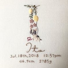 a cross stitch design with the date and year for this embroidered item, it is in white linen