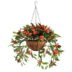 a hanging planter with red flowers and green leaves