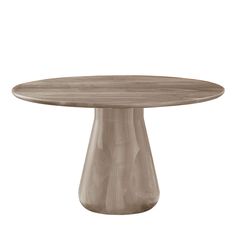 a round wooden table sitting on top of a white floor