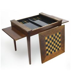 a table with a checkerboard design on the top and two side tables underneath it