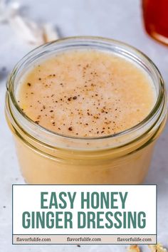 a glass jar filled with honey ginger dressing