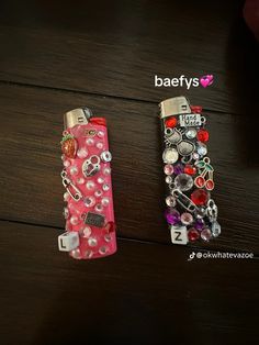 two lighters with different designs on them sitting next to each other and the words baeflys