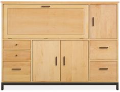 a large wooden cabinet with drawers and doors