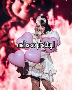 a woman holding pink heart shaped balloons with the words mel is so pretty