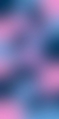 a blurry image of blue and pink colors