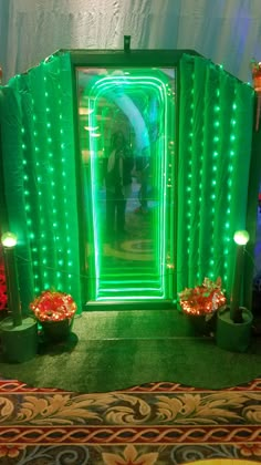 an open green door with lights on it