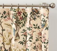 a curtain with birds and flowers on it