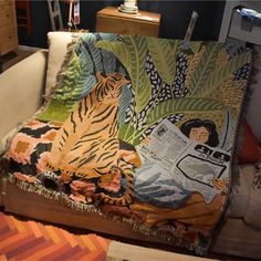 a couch with a tiger on it in a living room