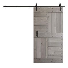 the sliding door is made from wood and has metal bars on each side, along with black hardware