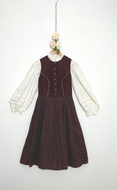 Vintage brown dirndl with ditsy floral pattern.  Top not included. Measurements: P it to pit: 17ins Waist, laid flat: 13ins Full length: 36ins Based on the measurements, this dress falls between a UK size 8 and UK size 10. Always refer to measurements before purchasing. Condition: very good #Dirndl #BavarianDress #Cottagecore #Tyrollean #AustrianDressl with ditsy floral pattern. Fitted Brown Prairie Dress, Brown Fitted Prairie Dress, Vintage Brown Prairie Dress For Fall, Fitted Brown Prairie Dress For Fall, Brown Vintage Prairie Dress For Fall, Fitted Brown Vintage Prairie Dress, Fitted Vintage Brown Prairie Dress, Bavarian Dress, Ditsy Floral Pattern