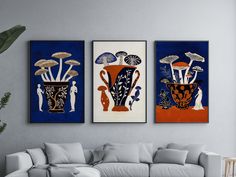 three paintings hanging on the wall above a couch