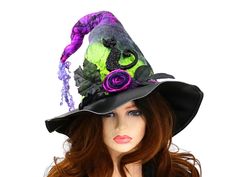 This spooky cat felt witch hat is ready for a festival, a photo shoot, a renfaire costume, a witch gathering, or your festive table centerpiece. I made this in deep rich colors of neon green, black, and purple to create an overall ombre effect. One of a kind, the tip is wired for extra crookedness, with a black sparkle cat perched above a hand felted rose. Black leaves pop out from either side. I've worked the curl into the hat, so the style and character are already built in. The quality vinyl Witch Hat Felt, Witch Gathering, Renfaire Costume, Neon Goth, Handmade Witch Hat, Hand Felting, Cat Witch Hat, Felt Witch, Felt Witch Hat