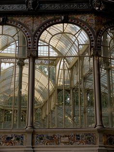 the inside of a building that has many windows and arches on each side of it