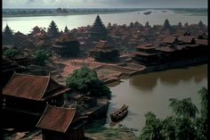 an aerial view of a village on the water