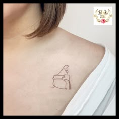 a woman with a small tattoo on her chest