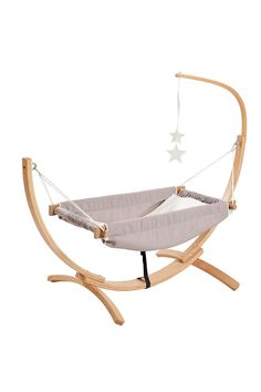 a baby's cradle with a star hanging from it