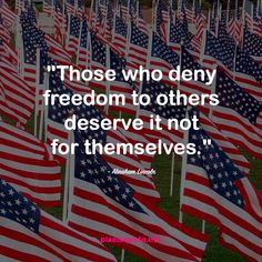 many american flags with the quote those who deny freedom to others deserves it not for themselves