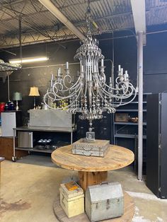 a chandelier hanging from the ceiling in a warehouse